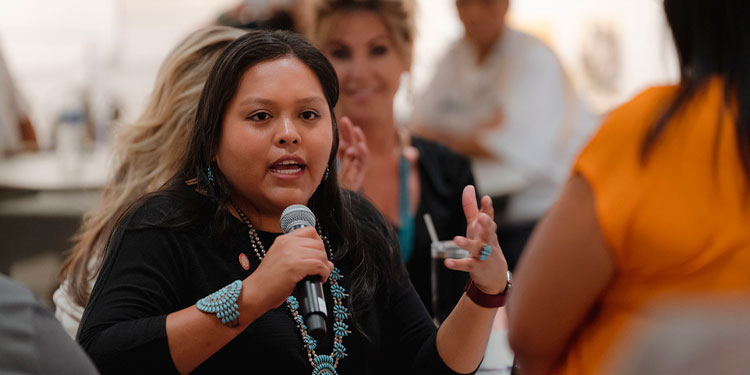 Photo of a Native American employee at an event